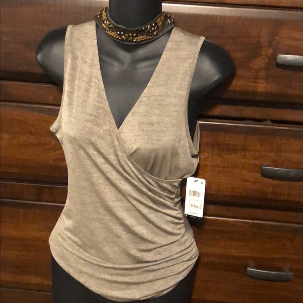Beautiful top! Beading around the neck